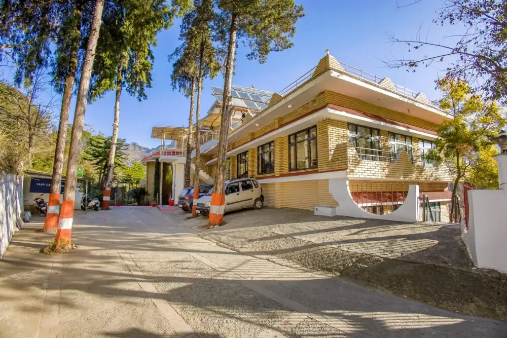 Secure free parking area at Vaapi Comfort Inn with shaded spaces