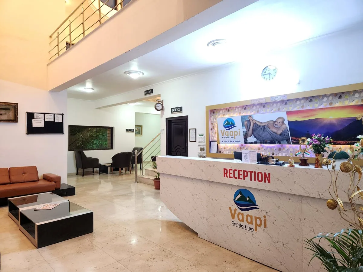 Grand Reception lobby at Vaapi Comfort Inn with welcoming front desk